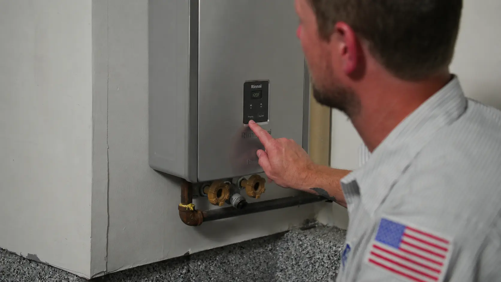 Donahue plumber servicing a tankless water heater